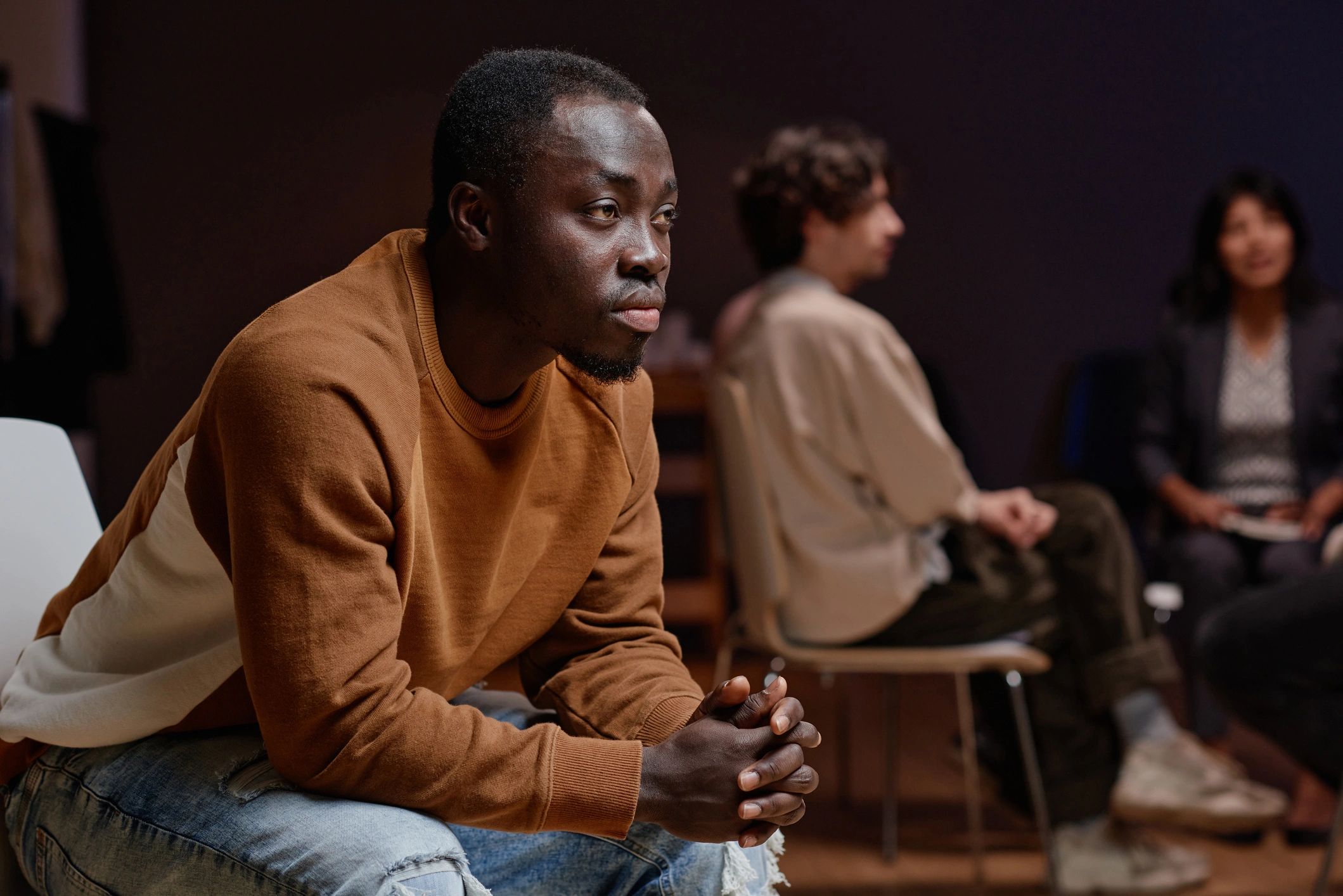 Black man participating in a community discussion